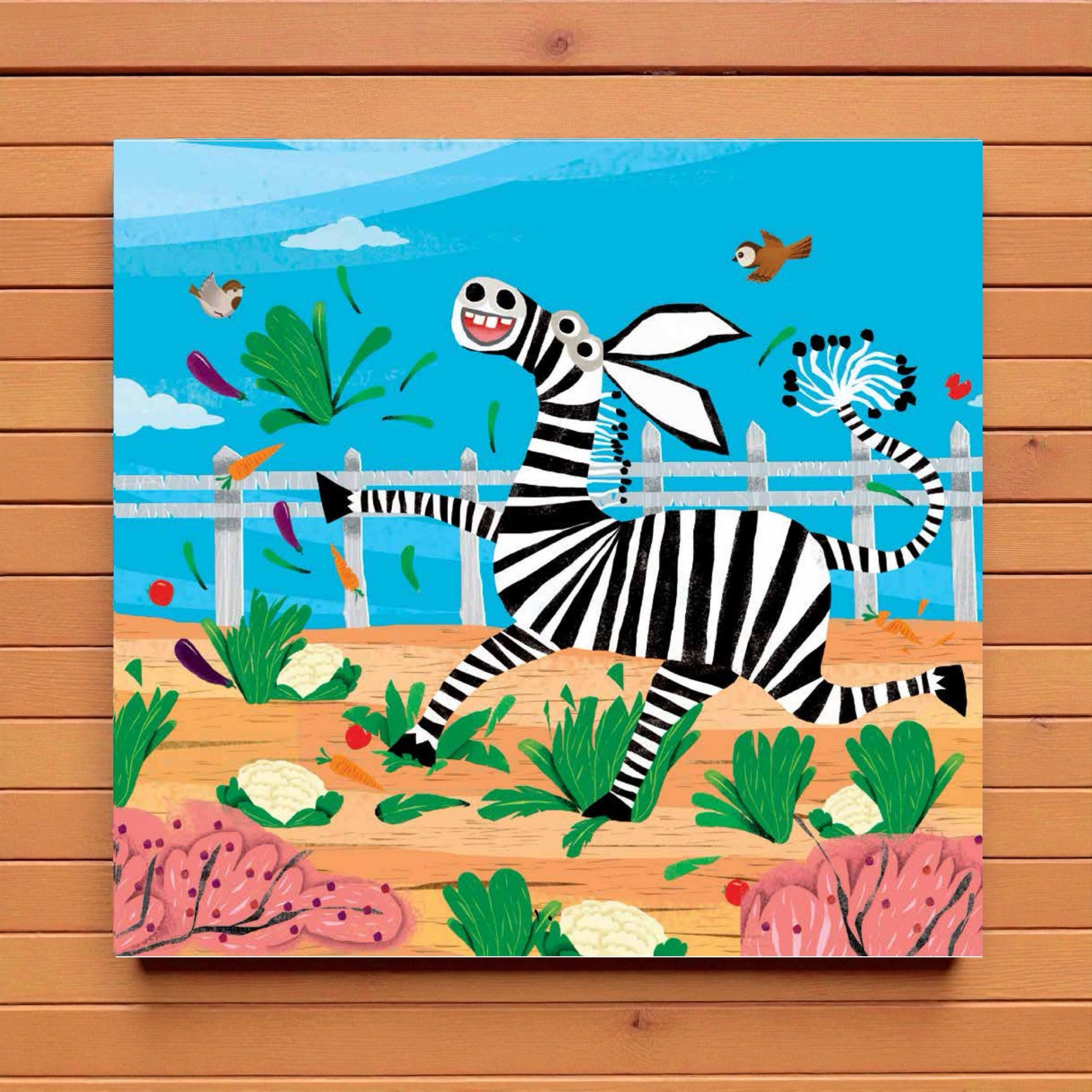 Children's illustration of a zebra playing with a ribbon on a wooden background